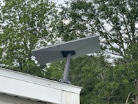 a solar panel mounted on the roof of a house